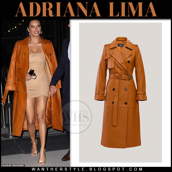 Adriana Lima in burnt orange leather coat and mini dress
