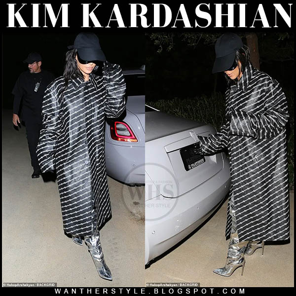 Kim Kardashian in black logo print coat and silver boots