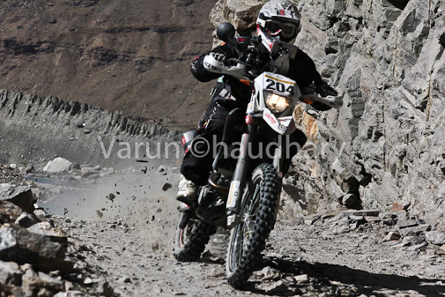 After extreme action of cars at Raid de Himalaya, it's time to have a PHOTO JOURNEY of Bikers. Usually bikes are more interesting to click as compared to cars, but in Raid everything is super exciting !!! Let's start this journey with bikes in action....This whole event is very well planned and everyone is well aware of actions to be happen during the week of Raid. I was really amazed to see the detailing of event at http://www.raid-de-himalaya.com/2011/Xtreme/supregs2w2011.pdf . I have seen documents of other motorsports in North India and most of them are really disorganized and planned very unprofessionally. The whole team of Himalayan Motorsports work really hard to make each thing very special and safe !!!Bikes are really specially for shooting and panning is one of the technique, which can't be missed during such events where bikers love to fly in air...Raid de Himalaya started from Peterhoff Hotel, Shimla and day one ended at Manali through Jalori Pass !!! Whole route was like  Shimla to Manali == Manali-Leh(via Sarchu) ==Leh-Leh(via Wari La & Khardung La) == Leh-Rangdum(via Kargil) == Rangdum-Rangdum(via Padum) == Rangdum-Srinagar(via Kargil)Himalayan Motorsports organize this wonderful event and here are some contact details -Himalayan MotorsportMotoworld, Navbahar, Shimla,Himachal Pradesh - IndiaPhone: +91 (0) 177 2842916Fax: +91 (0) 177 2844338Email: info@raid-de-himalaya.comTotal distance covered was 2200 kilometers, including 667 kilometers of competitive sections. 667 Kms were covered during 11 different competitive stages. The Moto Alpine was about running the first 3 legs of the rally and end at night haltof leg 3 at Leh. This shorter version was open to all newcomers to the Raid de HimalayaOnly those that had never participated before in the Raid (on a / Quad) are eligible tenter for the Moto Alpine.The Moto Xtreme was complete version of the Raid de Himalaya, running all 6 legs anwas open to both previous participants as well as the new entrants to the Raid, In shorwhereas a previous participant could not enter the Moto Alpine...Bikes of 100cc to 700cc participate in Raid and all of them are categorized into different classes, on the basis of their machine powers.Most of these folks used some imported bikes or modified versions of high power bikes. On top of that each biker needs to have a team to ensure that any break-down on the way can be fixed as quick as possible.Another special thing about these motorsport rallies is their route. Most difficult terrain are chosen with appropriate safely measures in mind. In fact, security planning takes various months to finalize things with Government and private agencies. All riders in Raid are really disciplined about safely as well. Following passion with proper safely measures is also very important.Raid de Himalaya rally passes through various villages in Himachal Pradesh and Jammu & Kashmir !!!Riding on such a road is a real luxury. At various points it's difficult to find the road on rough hills with landslides and water streams around !!! Riding bike in Raid is really difficult as riders have no option of driving the vehicles by sitting on closed cabins. Weather is another challenge for bike riders in Raid de HimalayaSome information picked from official Facebook page of RAID DE HIMALAYA Raid de Himalaya is among the most extreme motor sport events organized at an international level. It runs on the highest altitudes as compared to others including the Paris Dakar Rally. http://www.raid-de-himalaya.com/Mountains and Bikes seem to be made to be seen together. Several Indian travellers have now started taking on the mountains on their bikes. The main reason is the same as the the bikers participating in the rally - the thrill of scaling these heights.Navigating the curves, dodging the rocks, and leaving a dust trail, the riders manoever their mean machines faultlessly and spectators can't do much but stare at them with awe.They look the same at a glance, but all riders have their own unique techniques that only experts can detect.Amongst the barren, brown hills the only streaks of colour are these motorbikes. For the duration of the rally, the region comes alive with these dashing, roaring machines.In spite of the tiring route that not only makes you push the boundaries of your schools, each biker starts longing to return for another ride, another adventure soon after one is over.Rearing and roaring like a wild beast, these bikes are merely pets in their riders' hands, obeying each command, following each direction to the last letter.Once the race is over and the bikers have left, the hills lie forlorn, full of longing for these noisy destructive forces of technology to come and make them come alive again.The heights seem scalable and the terrain no longer a foe, when you are flying on your machine. No wonder each biker comes back year after year to scale these heights till they become as familiar to them as the back of their hands. 