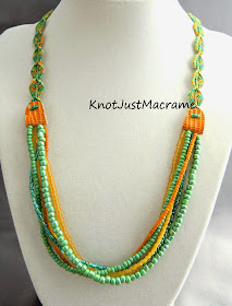 Micro macrame necklace by Sherri Stokey with knotted leaves, leather connectors and multiple strands of beads.