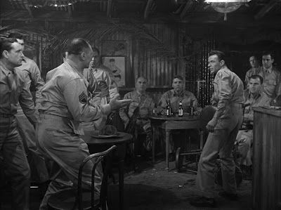 Maggio (Frank Sinatra) antagonizes sadistic stockade sergeant 'Fatso' Judson (Ernest Borgnine).