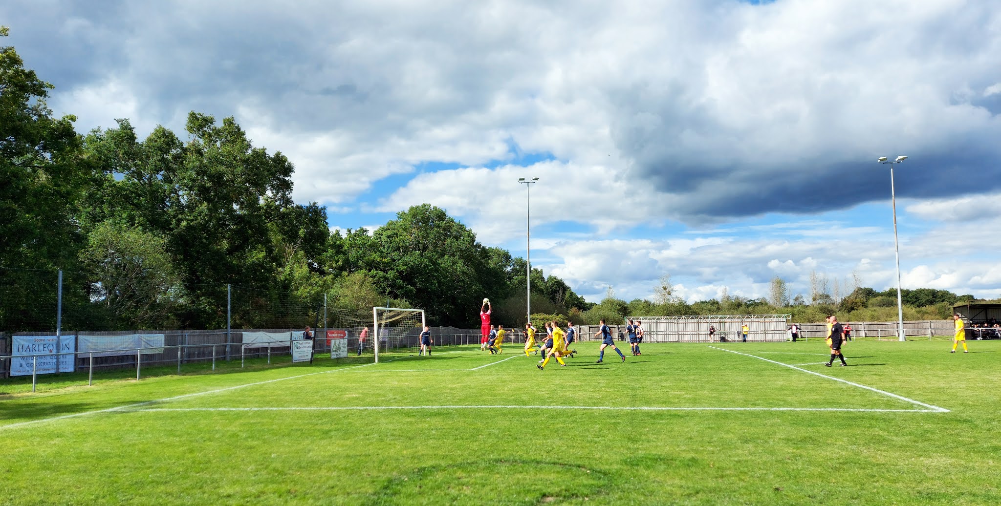 Hamble Club FC's goalkeeper, Ellis Grant, catches a Tadley Calleva cross