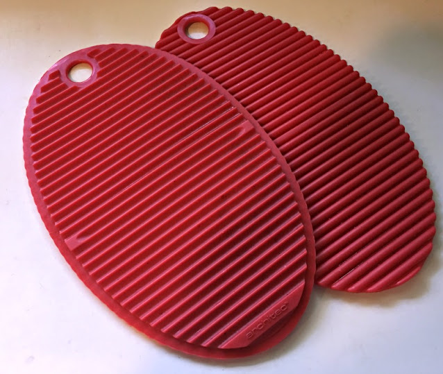 Pair of red oval ribbed silicone potholders