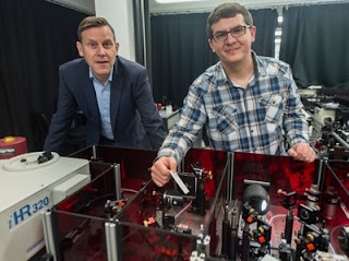 At the laser and infrared spectrometer: Prof. Peter Vöhringer (left) and Steffen Straub in the Institute for Physical and Theoretical Chemistry at University of Bonn. (c) Photo: Barbara Frommann/Uni Bonn Click to Enlarge.