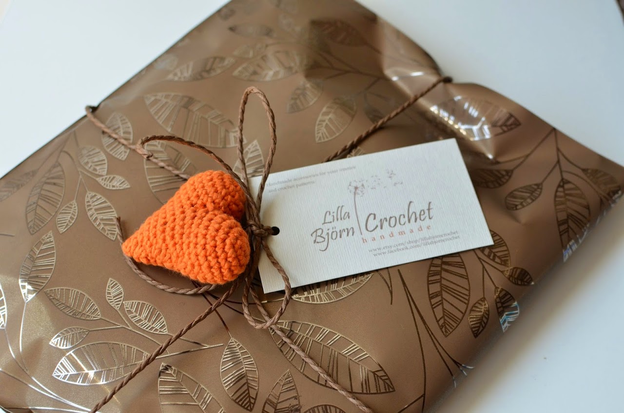 Handmade gift wrap with crocheted heart