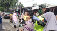 TNI-POLRI Bersama Pemkot Balam Bagikan Masker ke Masyarakat Dengan Penetapan Kota Balam Sebagai Kawasan Wajib Pakai Masker