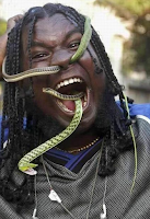 A man enters a living snake from his nose and takes it out of his mouth