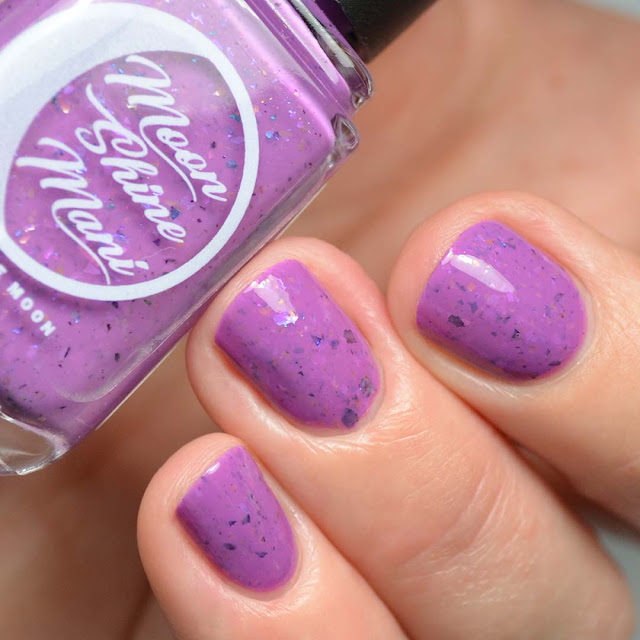 purple nail polish with flakies