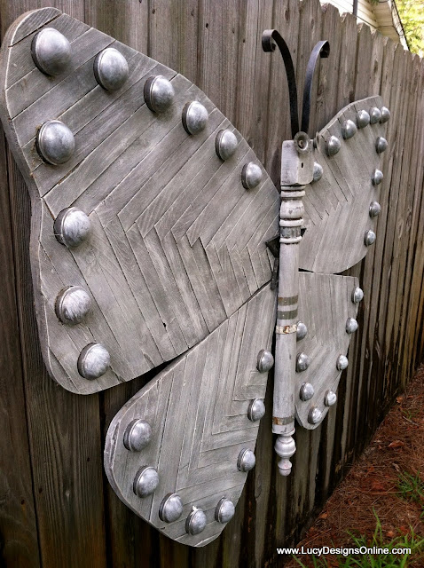 over sized wooden butterfly art in whitewashed gray