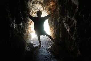 Danielle in a cave tunnel