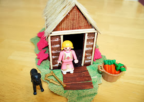 Tessa enjoyed dressing up our completed Viking longhouse with Playmobil accessories.