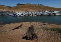 Low water levels caused by drought at the New Melones Lake reservoir in central California (Credit: Mark Ralston/Agence France-Presse — Getty Images) Click to Enlarge.