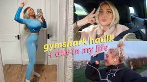 Thumbnail picture of a youtube video with three images of a young blonde girl posing and a text on top of the images in the centre saying "gymshark haul!!! + day in my life"