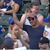 Cubs fan catches foul ball while holding daughter (Video)
