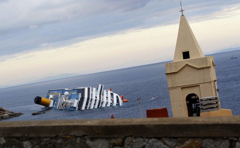 Italian Cruise Ship Costa Concordia Topples at Shore