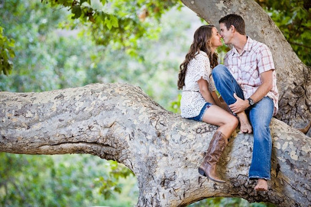 cute couple poses for pictures