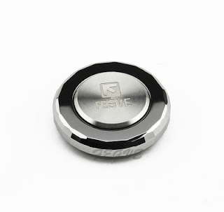  A tiny, circular fidget spinner made of tungsten. 