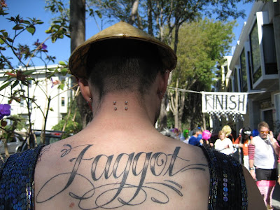 Faggot text tattoo