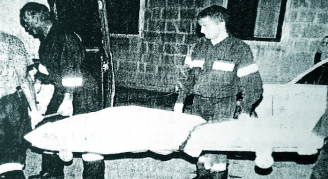 the victim's body being removed from the scene by the police