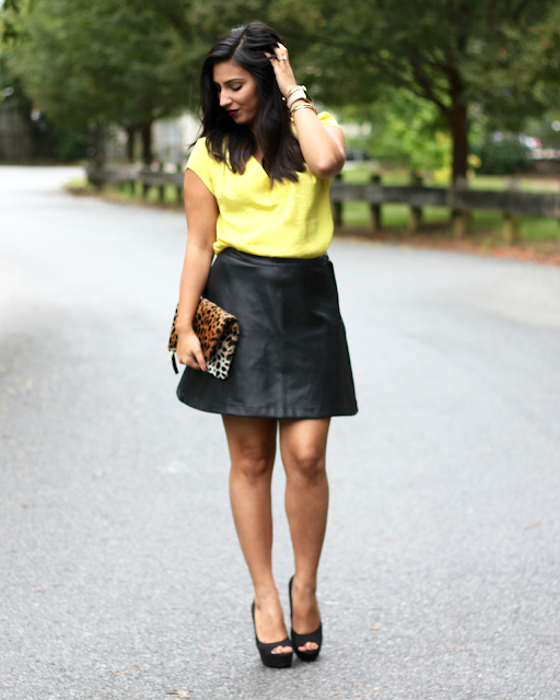 faux leather skirt, yellow satin blouse, leather skirt, a line leather skirt, leopard clutch, clare v, clare v clutch, kat von d vampira, kendra scott, apple watch fashion, fashionable apple watch