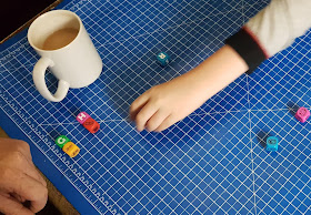 How to play Dice Academy showing pairs and hands and loose dice on table