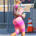 Amber Rose flaunts derriere in pink bodysuit