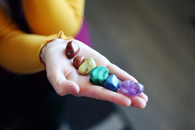 A lady has colourful stones