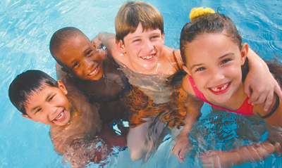 Picture of happy children in the pool. Conquer Their Fear Of Swimming Lessons