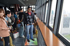 Standing on top of the look down window in Tokyo Tower