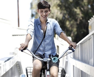 Gabriela Oltean riding a bicycle