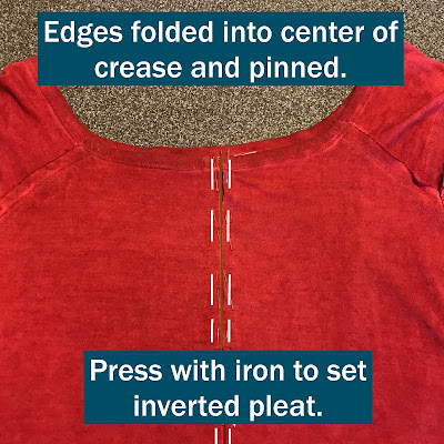 Red top with instructions on folding pleat edges to center.