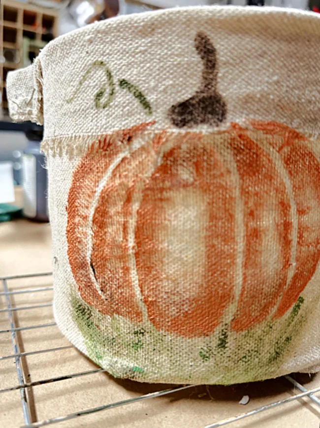 stenciled pumpkin on bucket