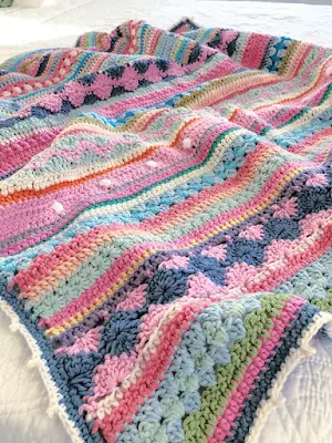 Crochet blanket with bright colors.