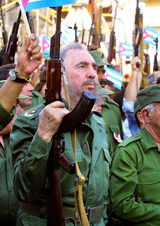 Cuban pioneer Fidel Castro with an AK-47 Kalashnikov automatic weapon 