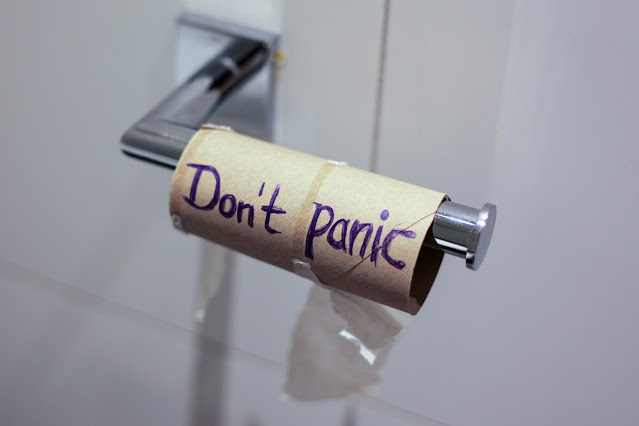 empty toilet roll with words "don't panic" on:Photo by Jas Min on Unsplash