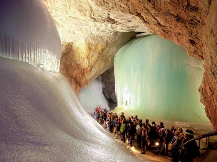 The Eisriesenwelt (German for "World of the Ice Giants") is a natural limestone ice cave located in Werfen, Austria, about 40 km south of Salzburg. The cave is inside the Hochkogel mountain in the Tennengebirge section of the Alps. It is the largest ice cave in the world, extending more than 42km and visited by about 200,000 tourists every year.