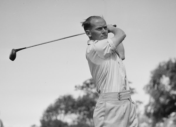 Golfer Eric Cremin swings a driver in 1945