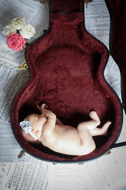 baby in guitar case newborn guitar photo