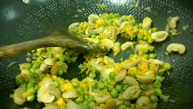 Onion, mushroom and peas and butternut squash are being fried