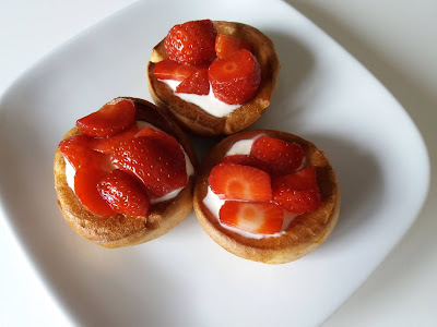 Yorkshire puddings filled with creme fraiche and topped with fresh strawberries