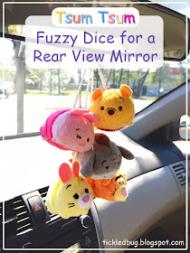 winnie the pooh piglet eeyore tigger rabbit disney tsum tsum characters fuzzy dice hanging from the rear view mirror of a car in the sunshine