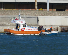 The Coast Guard checking a boat inside the Porto Mediceo, Livorno