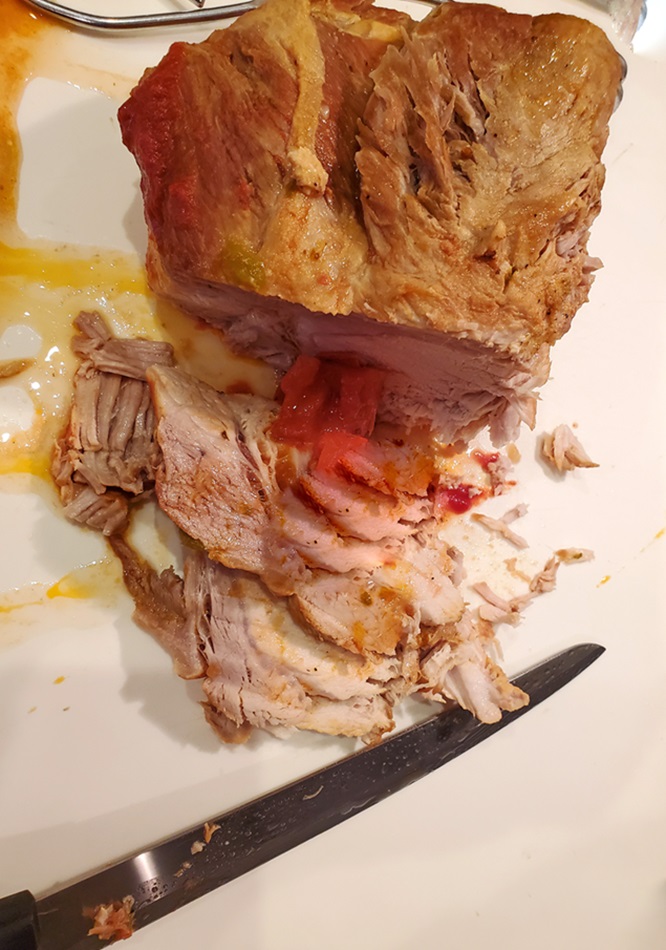 orange pork butt slow cooked and sliced