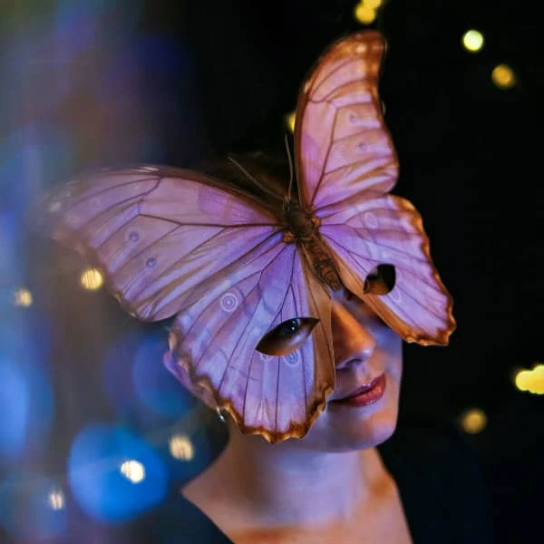 young woman modeling butterfly mask