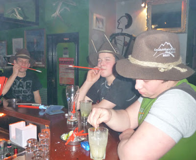 Boys smoking through straws in a bar in Zell am See, Austria