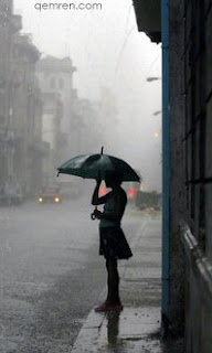 girl in rain waiting for someone