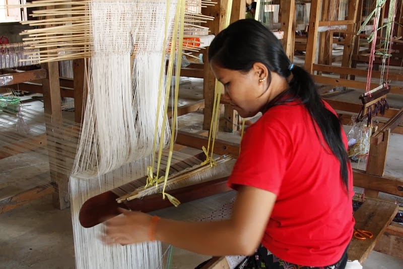 The painstaking work to prepare the yarns and set up the loom means much of the work is already done when the weaver sits at her loom. 