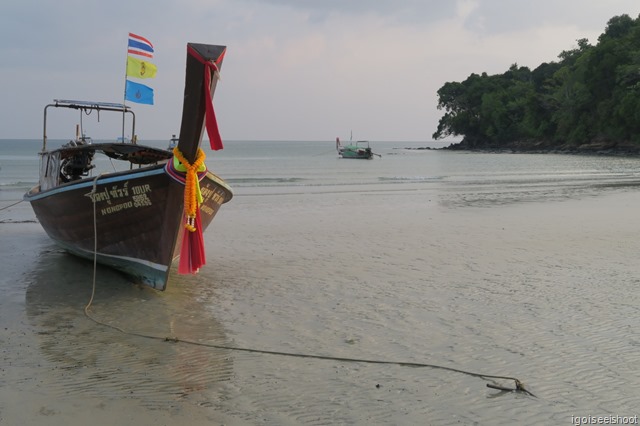 Long-tail boat parked at Klong Muang beach next to the Nakamanda Resort.