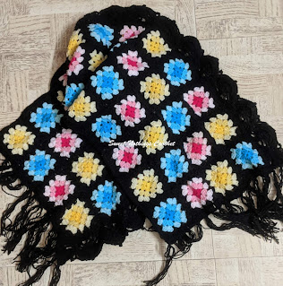 Sweet Nothings Crochet free crochet pattern blog, free crochet pattern for a granny square wrap with border, photo of the Stained Glass wrap, this blog has video tutorials for all stitches used,