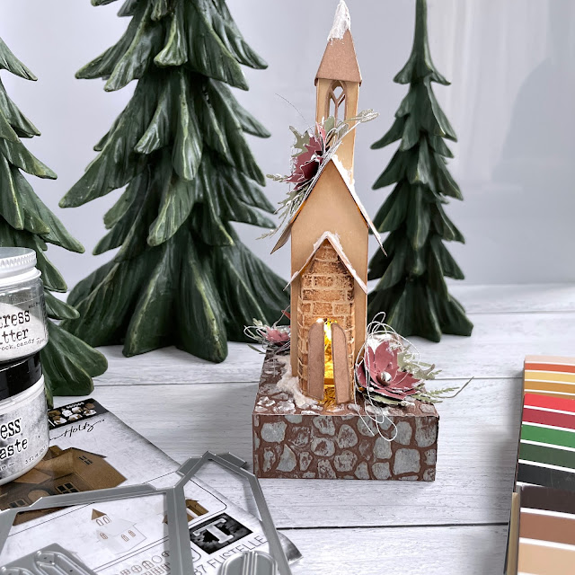 Mini Christmas Church Tutorial made with:  Tim Holtz Sizzix Village Collection, mini cobblestone and brickwork embossing folders, funky festive dies, Distress In and Oxides, tiny lights, Ranger grit paste, rock candy glitter, alcohol inks; Scrapbook.com A2 smooth cardstock in harvest, christmas, neutrals